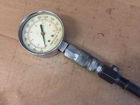 engine compression gauge with quick release tools needed to work on engines