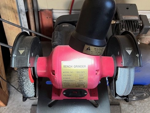 cleaning bolt threads on wire wheel bench grinder for garage workshop