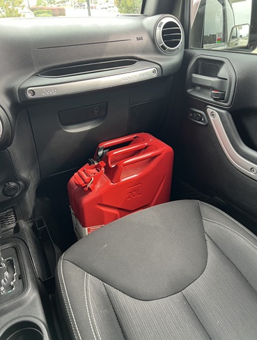 best way to transport a fuel container inside a passenger vehicle
